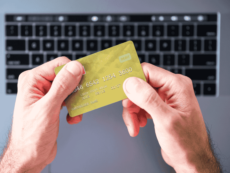 Hands-holding-Summer-EBT-card-applying-online